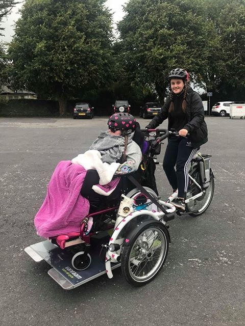 wheelchair transport bike cycling together