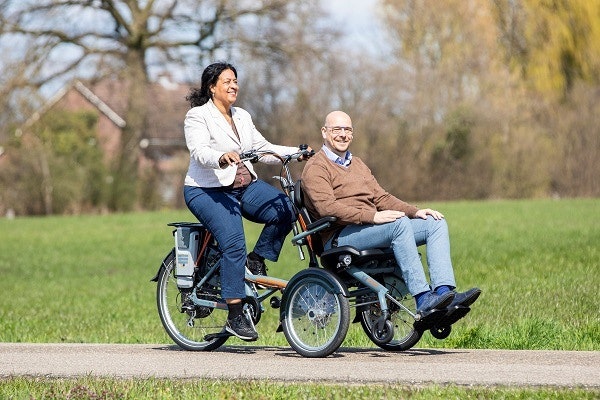 Van Raam OPair bike with wheelchair in front