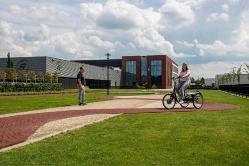 Trying a tricycle yourself during test ride at Van Raam