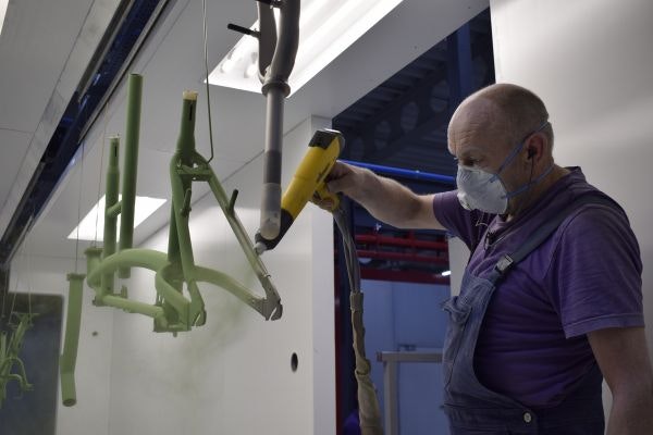 Powder coating of parts in the Van Raam paint shop.