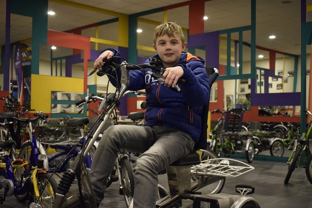 Tim with his electrical tricycle