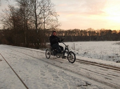 Van Raam tricycle user cycling in the snow