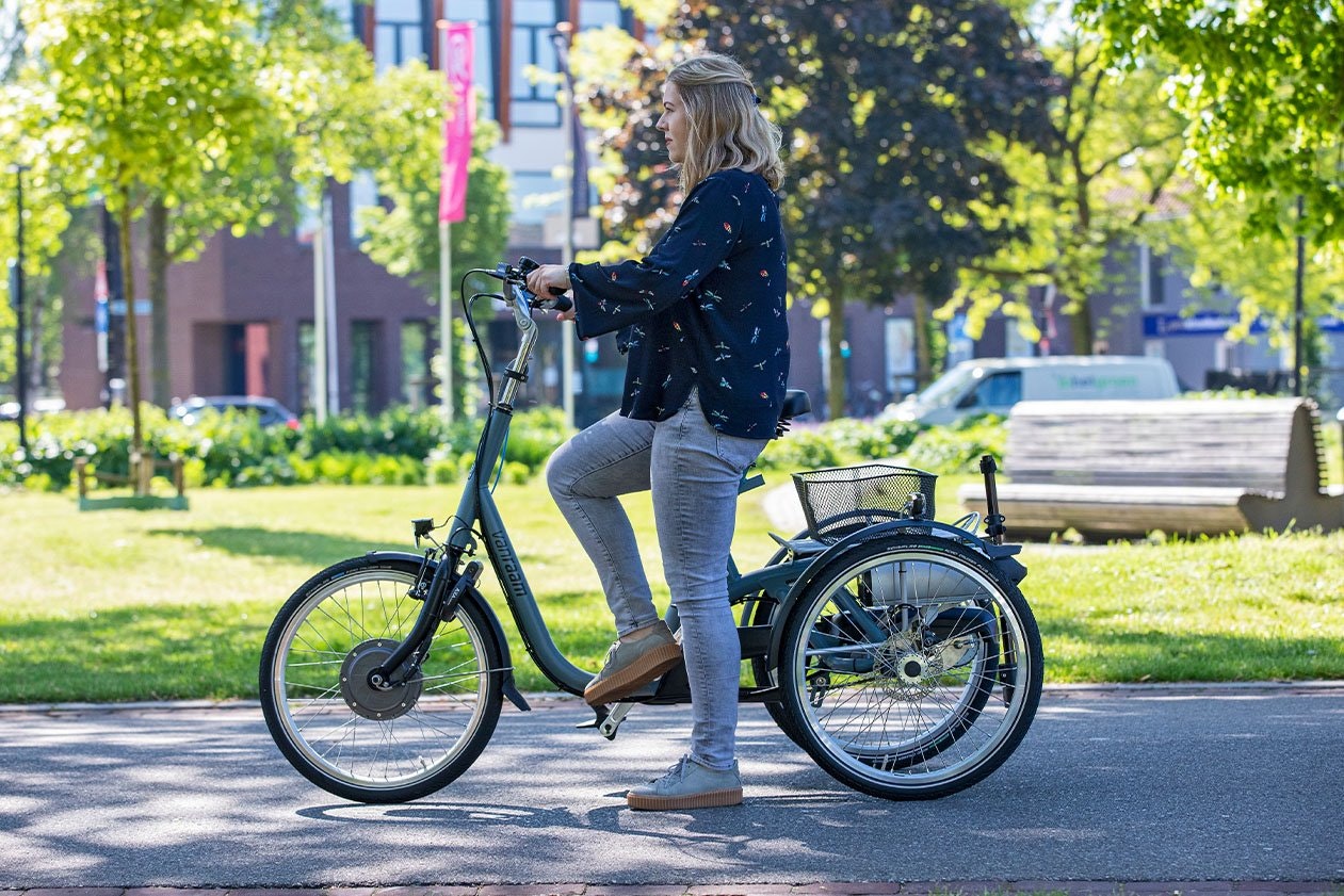 Getting on Van Raam Maxi tricycle for adults with a disability