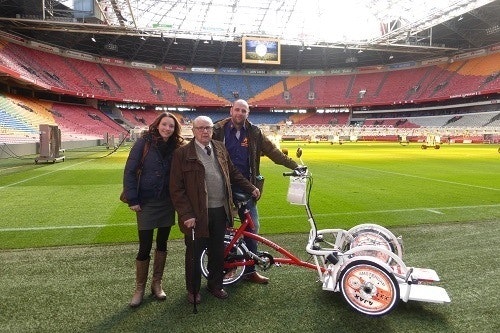Delivering Ajax a wheelchair bicycle in the Amsterdam Arena