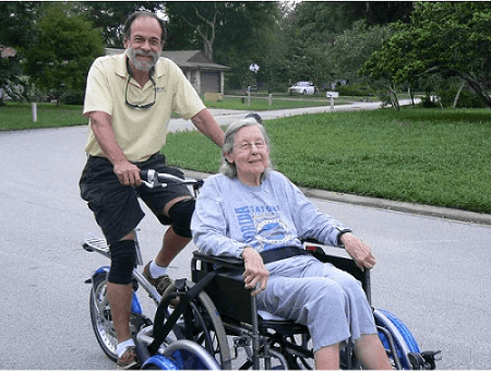 biycle for transporting individual on wheelchair