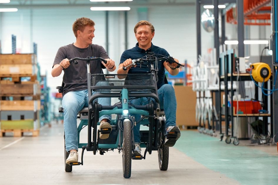 Cycling together on the vanRaam Fun2Go side-by-side tandem through the factory