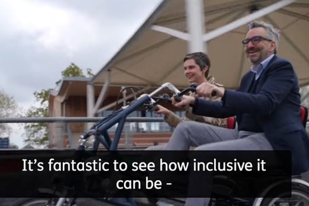 Chloe Smith MP Minister for Disabled People, Health and Work and Tim Hollingsworth on fun2go twin bike