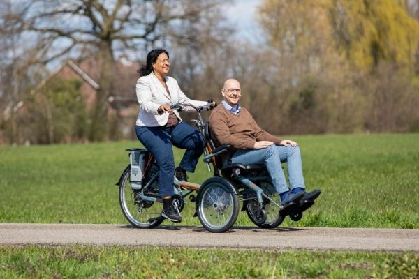 Cycling together with OPair wheelchair bike by Van Raam