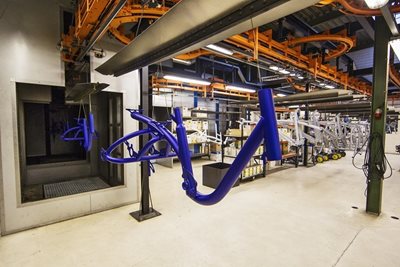The powder coated frame comes out of the oven in the Van Raam paint shop.