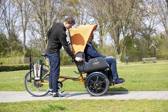 Van Raam rickshaw transport bike for Cycling Without Age - cycling with the canopy