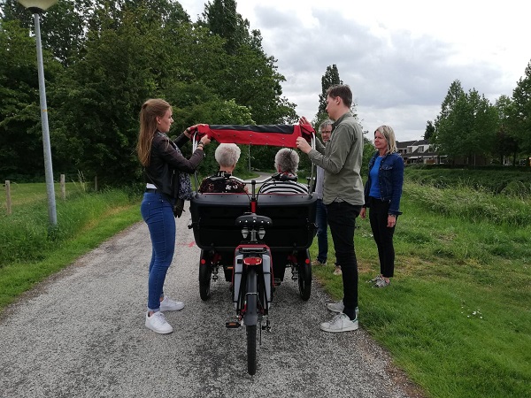 Riksja cargo bike Chat fotoshoot Van Raam inklappen huif