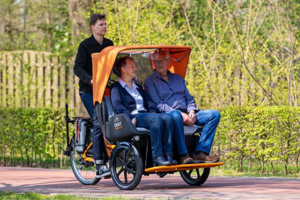 Coronascherm riksja fiets Chat Van Raam