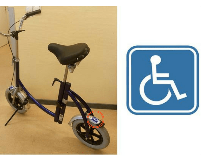 loopfiets met internationaal rolstoelsymbool