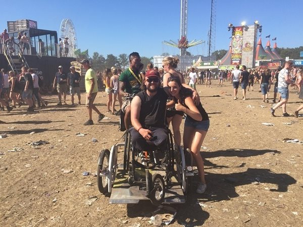 With the wheelchair bike on the grounds of the Zwarte Cross