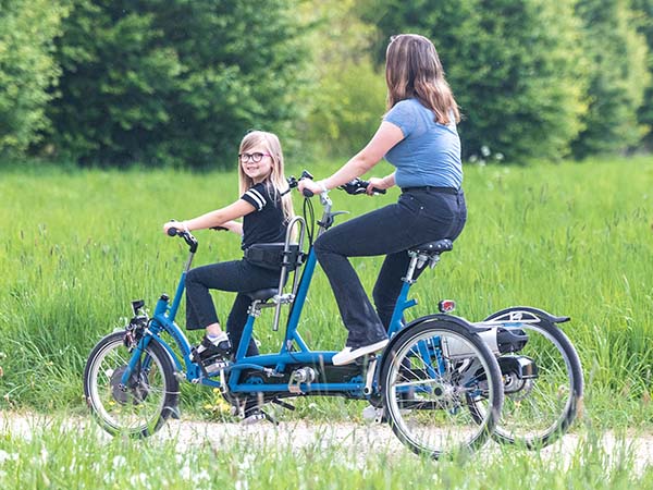 Cycling with varying energy levels Van Raam Kivo tricycle tandem for child and adult